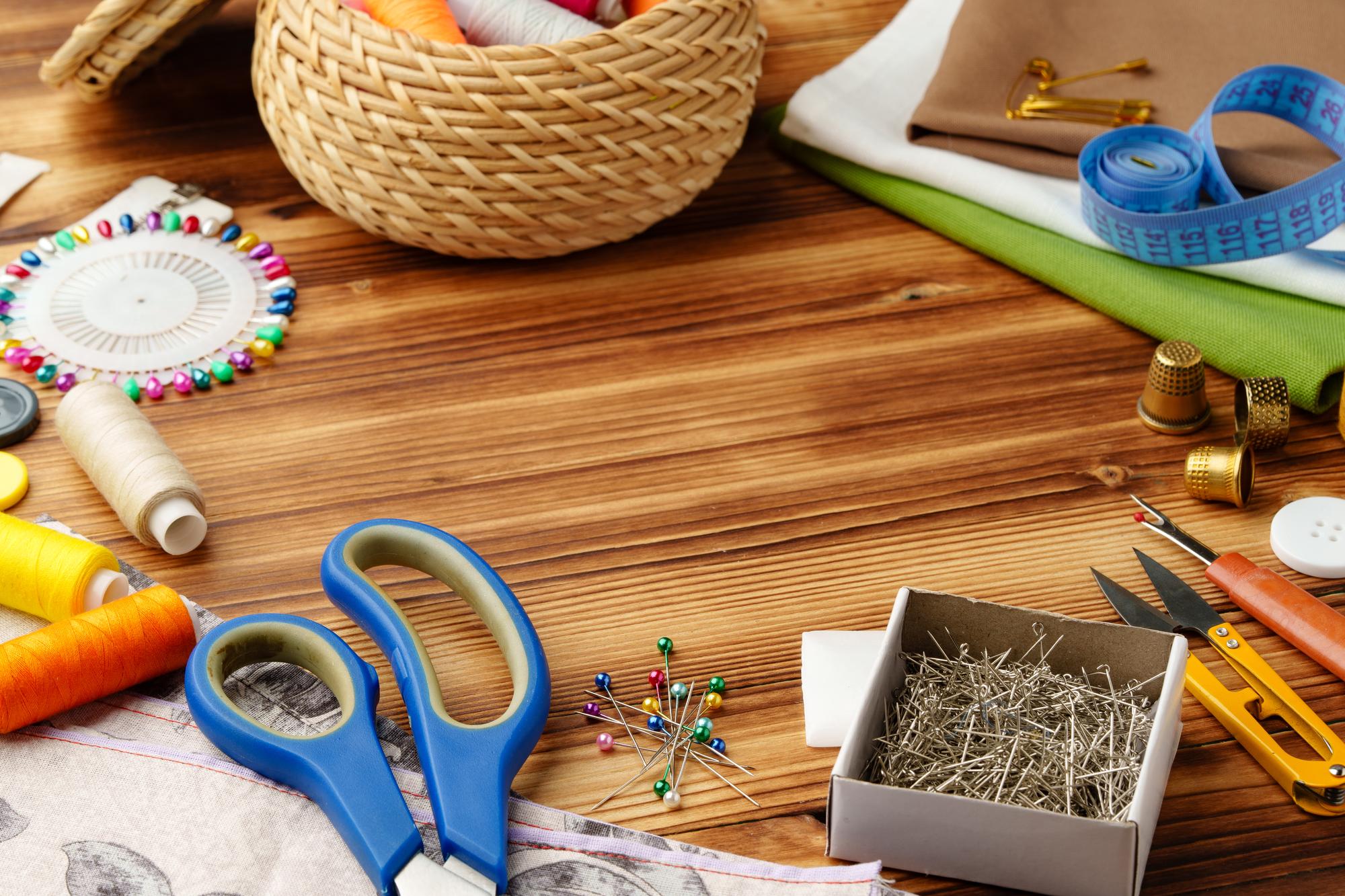 Workshop table with threads and vintage scissors